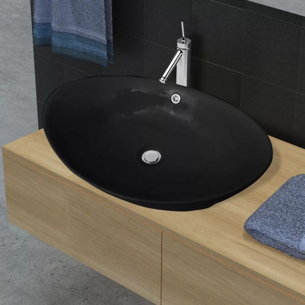 Lavabo Oval de cerámica negra de lujo con desagüe. 59 x 38.5 cm D